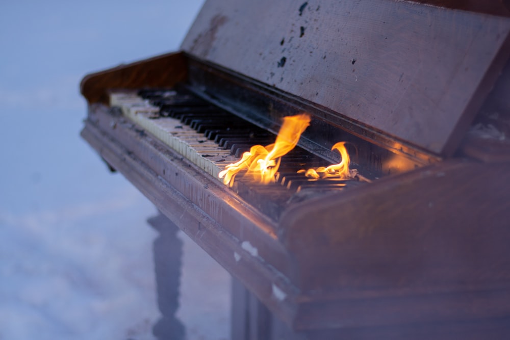 fire on brown piano