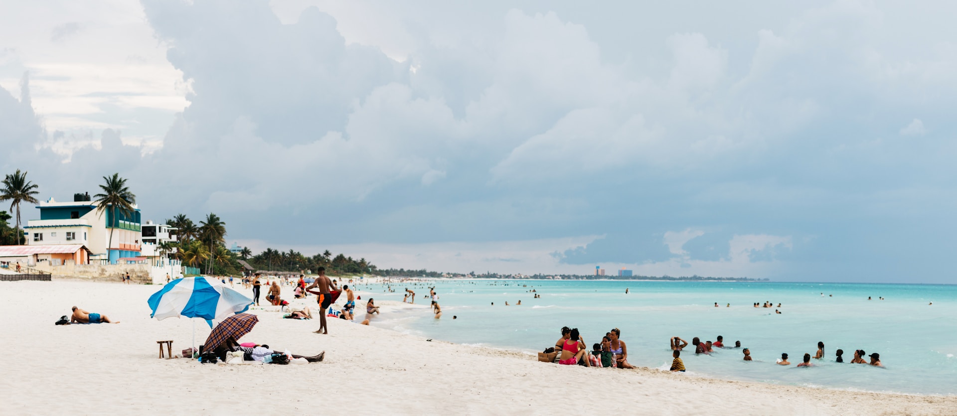 people on seashore during daytime