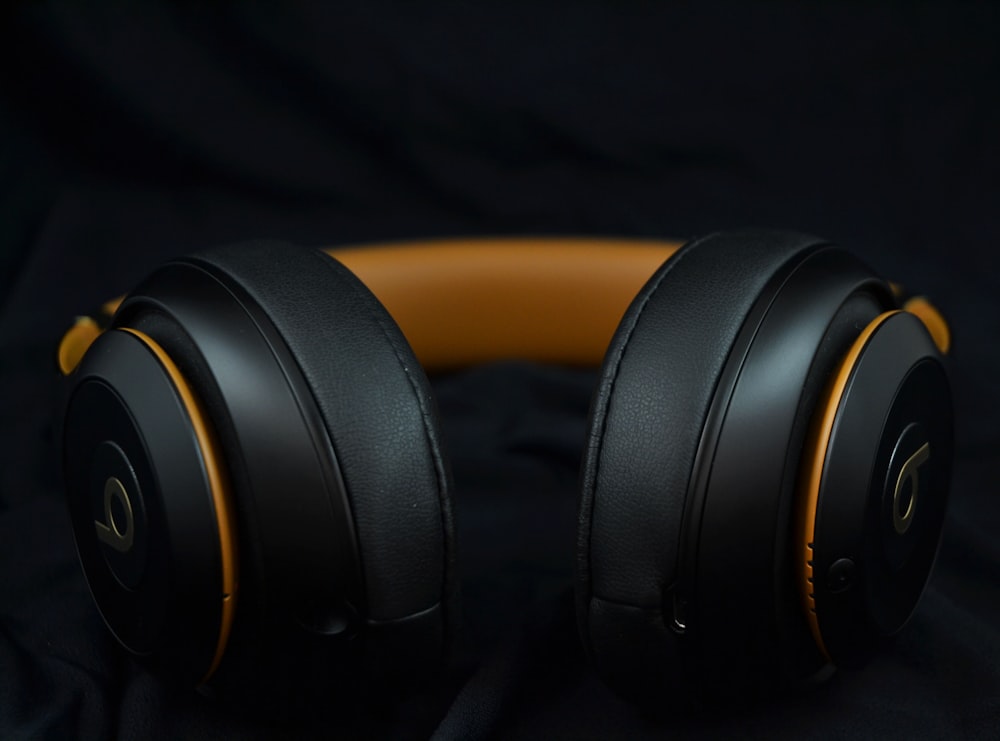 black and orange wireless headset