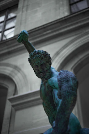 A heroic figure holding a glowing dumbbell with epic, ancient Greek-inspired armor elements.