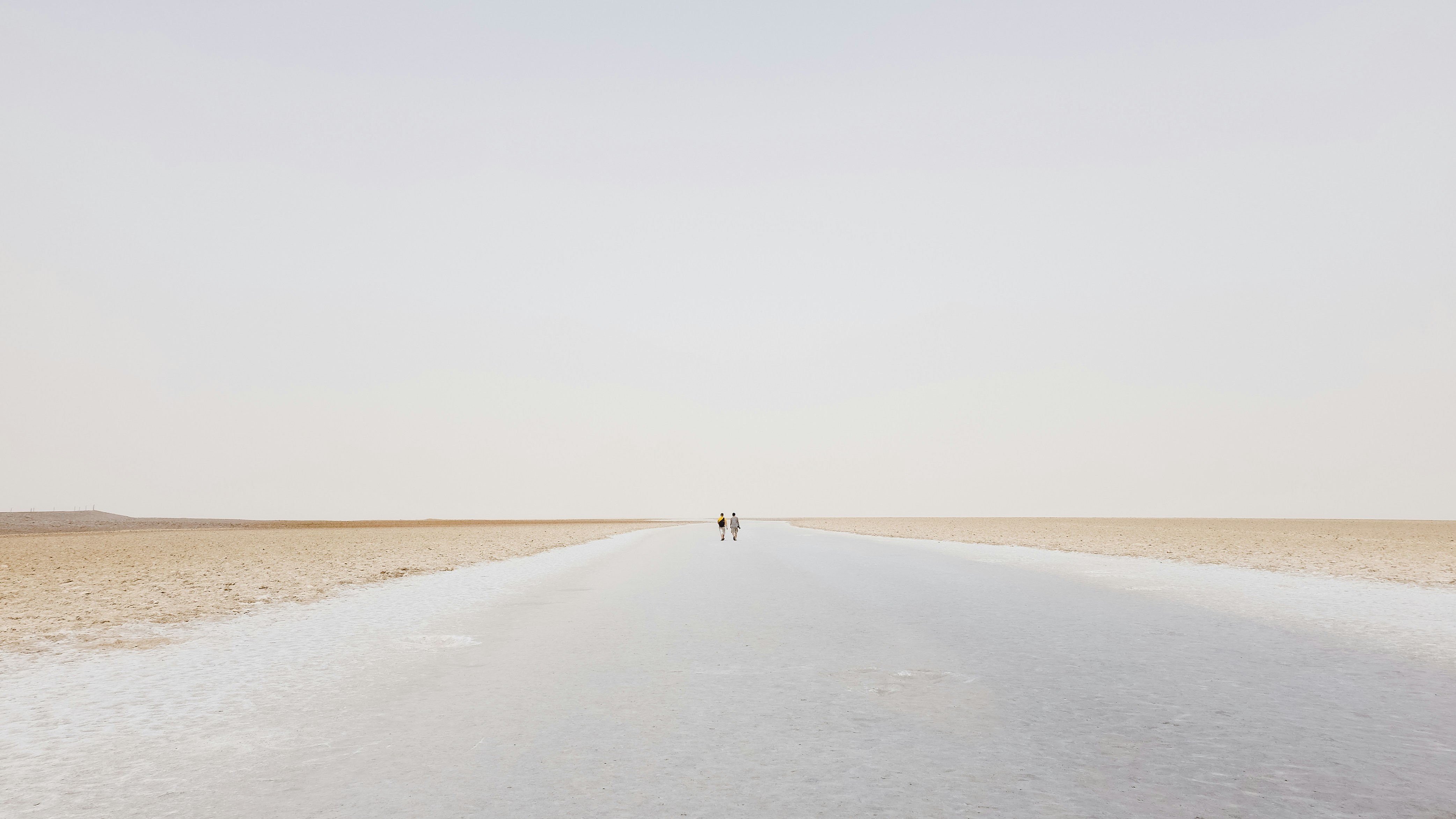 two person walling on desert, 