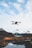 A drone capturing aerial footage over a scenic landscape.