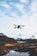 A drone capturing aerial footage over a scenic landscape.