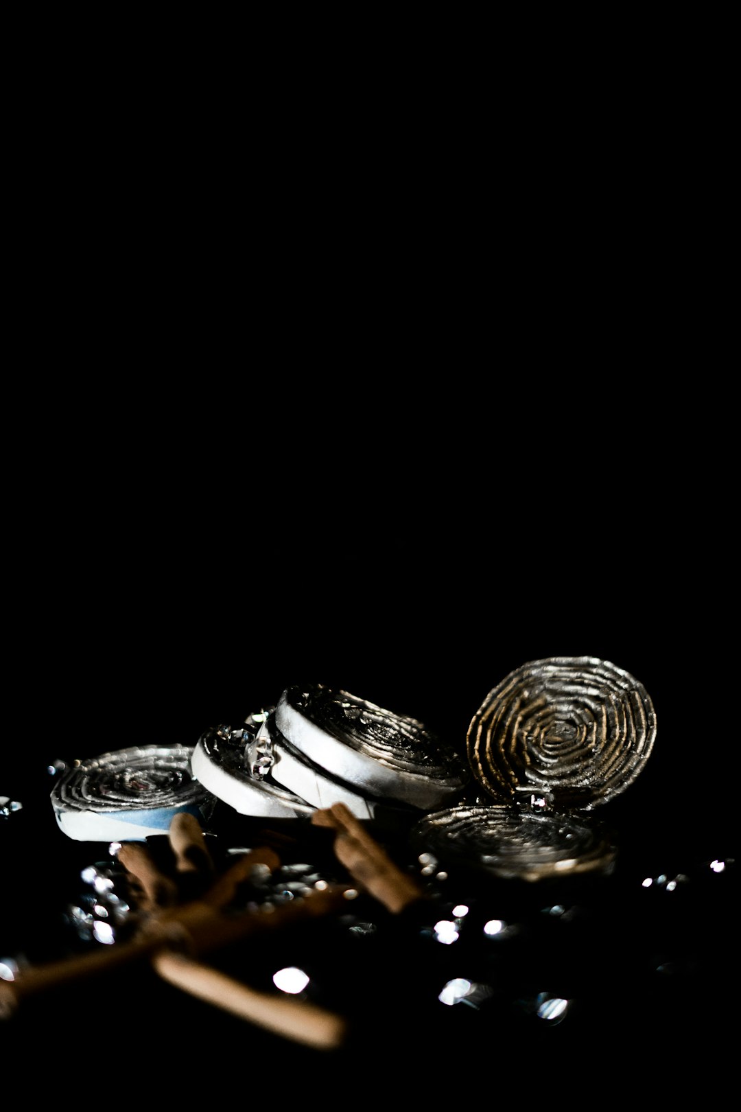 several round silver-colored coins