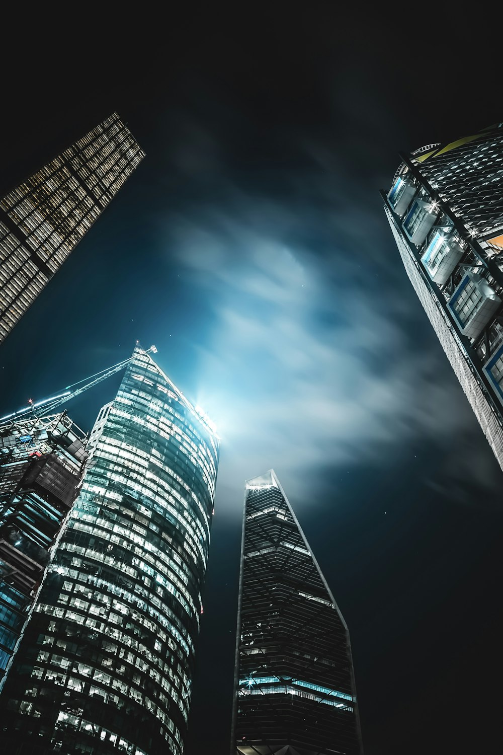 high-rise buildings under black sky