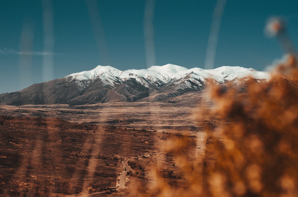 view of mountains under clear blue sky