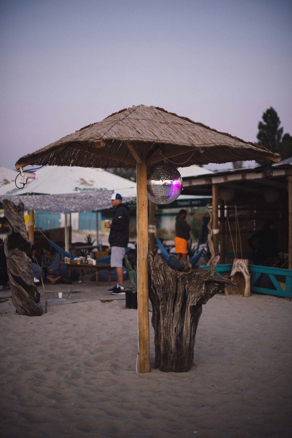 people on beach huts