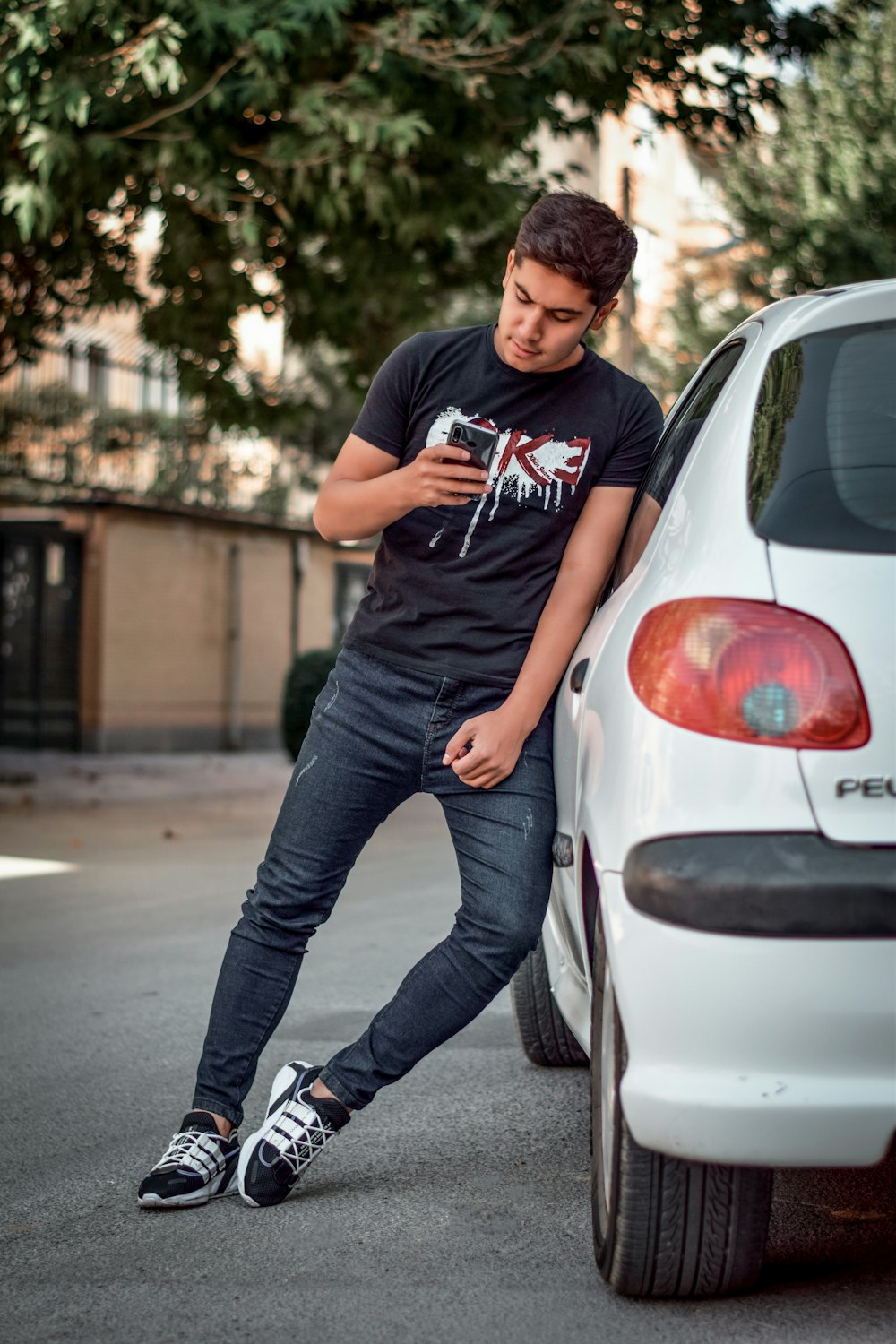 man leaning on vehicle