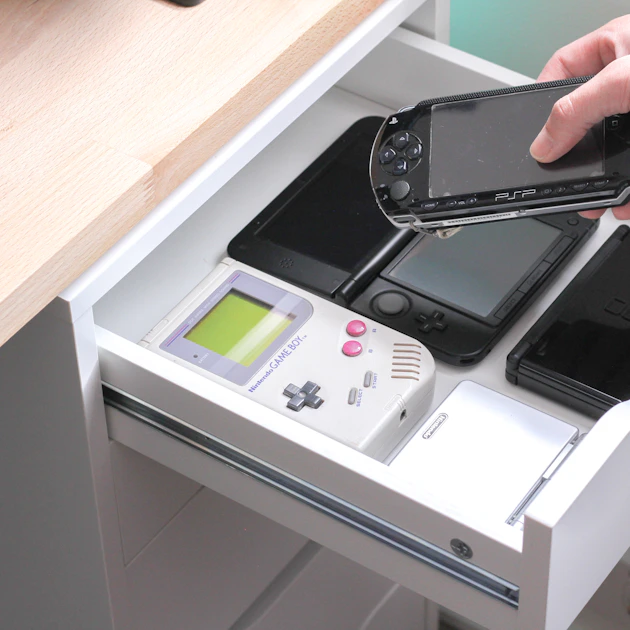 The Anbernic RG Vita handheld shown from the front, echoing the PlayStation Vita silhouette