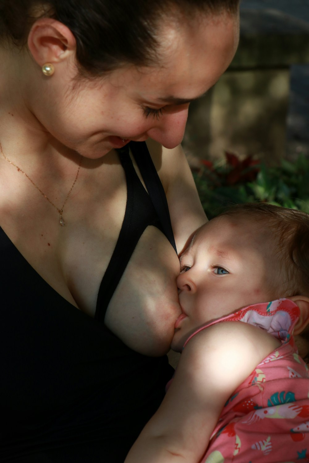 woman breastfeeding baby