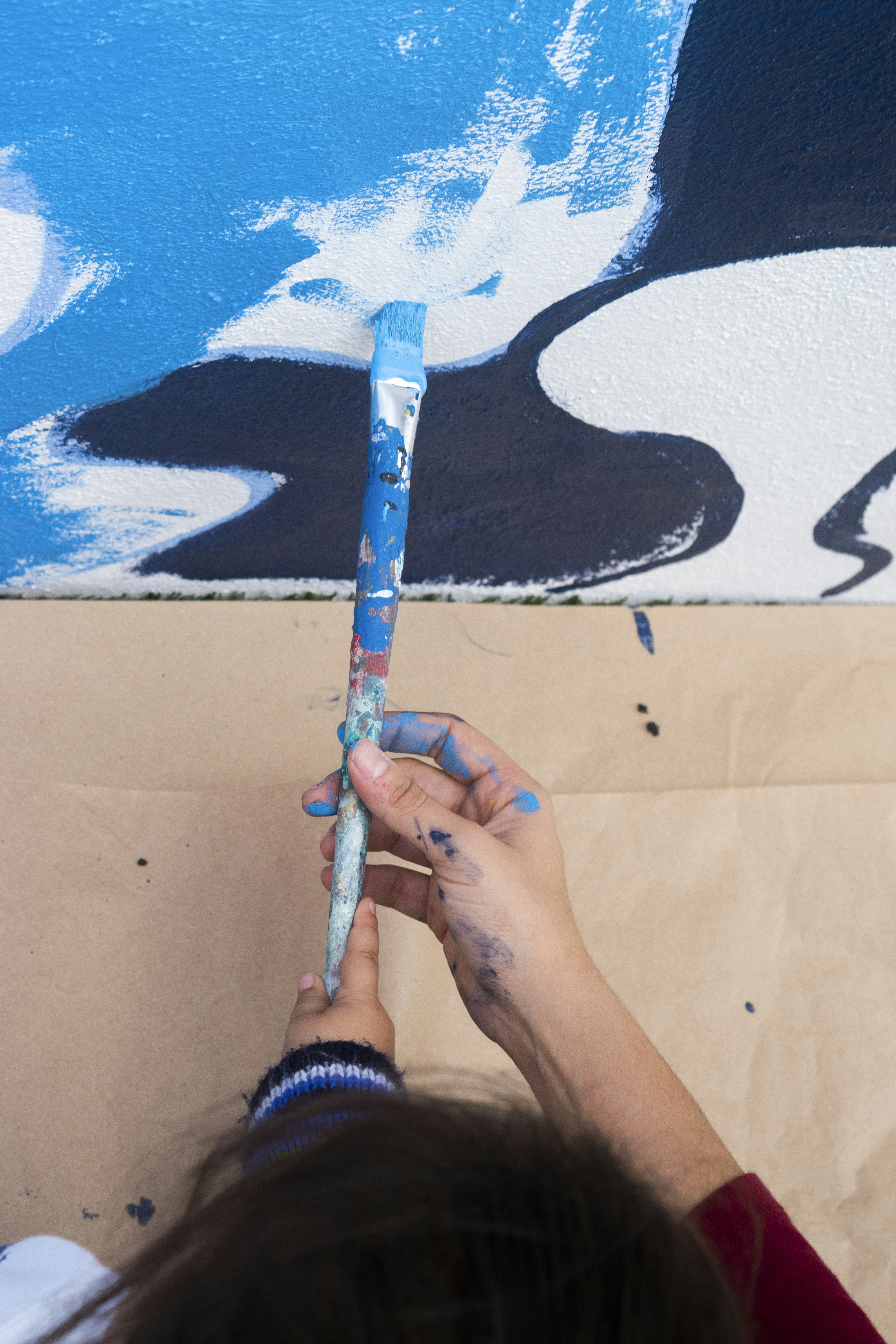 Luca Ferretti, Italian muralist with paint-stained hands