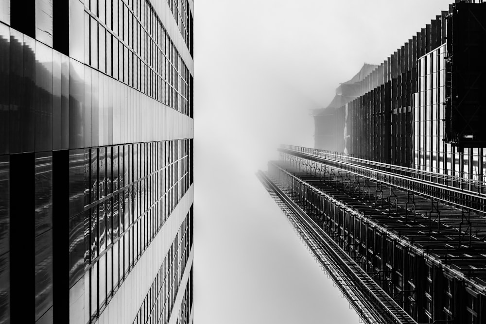 a black and white photo of tall buildings