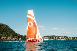 Vodafone now called Telecel - orange and white boat during daytime