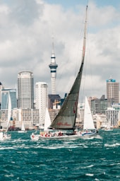grey and white sailboat during daytime