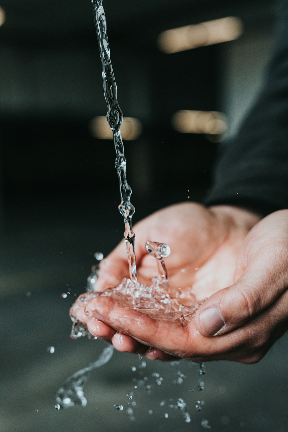 person holding clear water