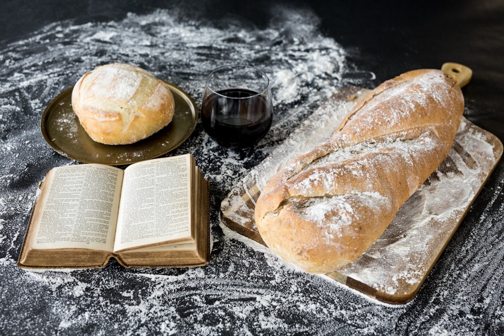 baked bread beside book
