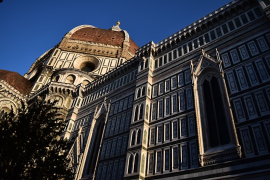 brown and white dome building during daytime in Cathedral of Santa Maria del Fiore Italy