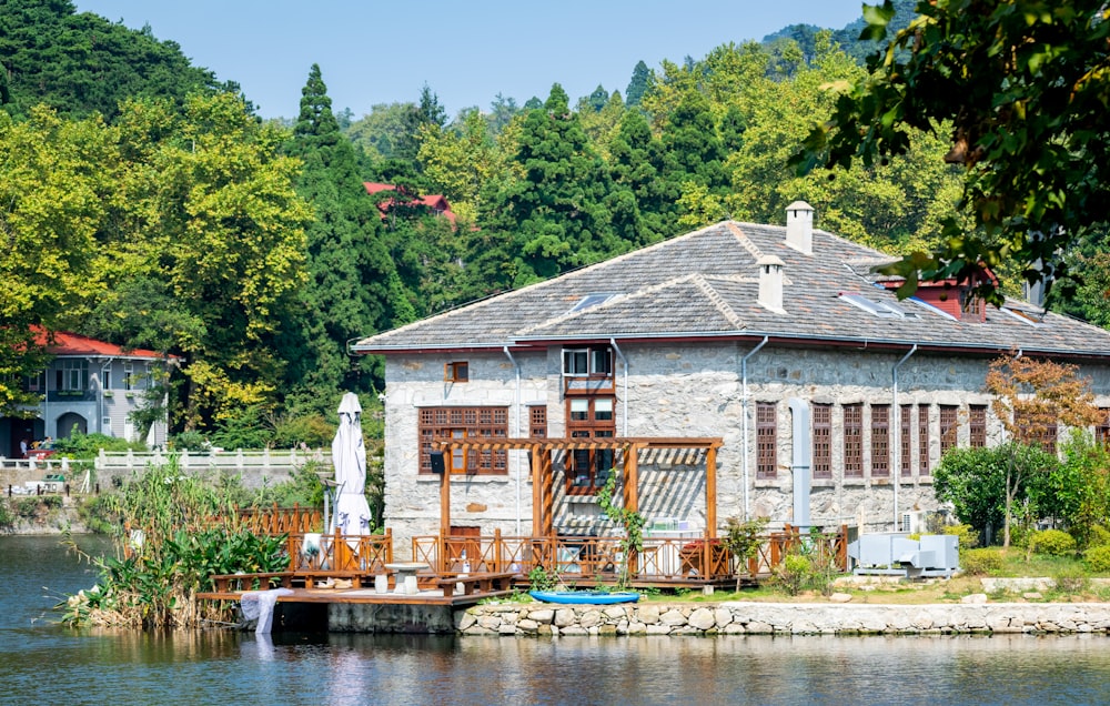 grey and brown house near river