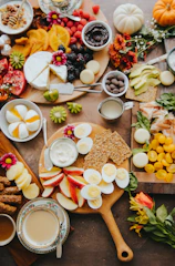 Healthy snacks arranged on a rustic wooden table with natural lighting.