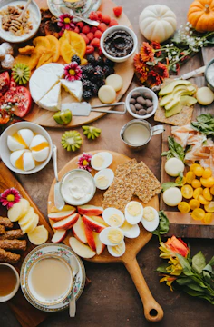 Healthy snacks arranged on a rustic wooden table with natural lighting.