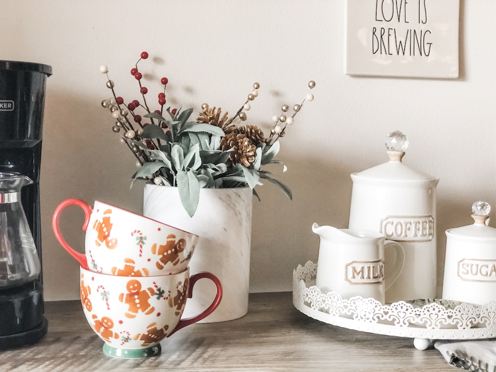 orange and white floral ceramic teacups