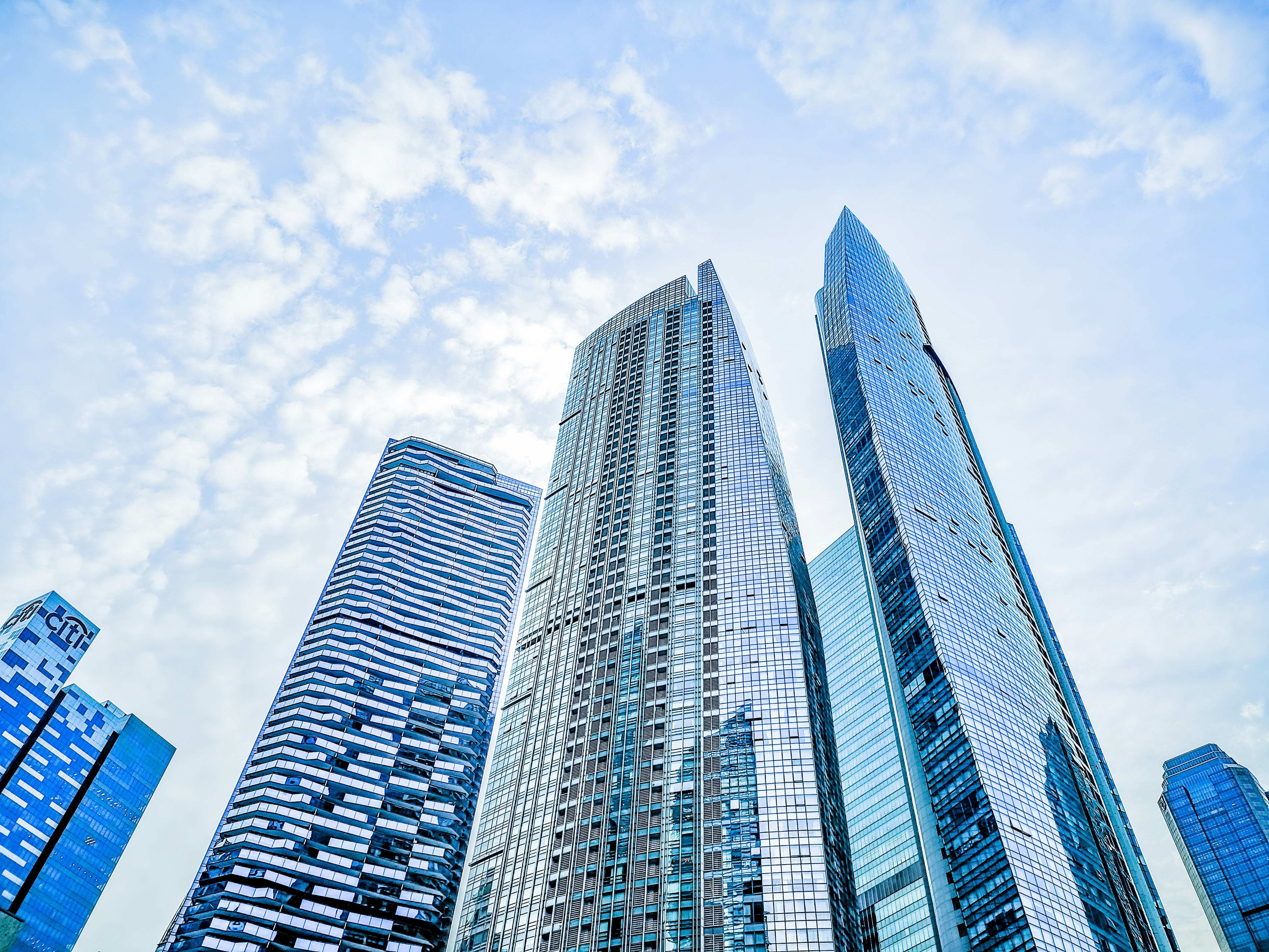 low-angle photo of high-rise building during daytime