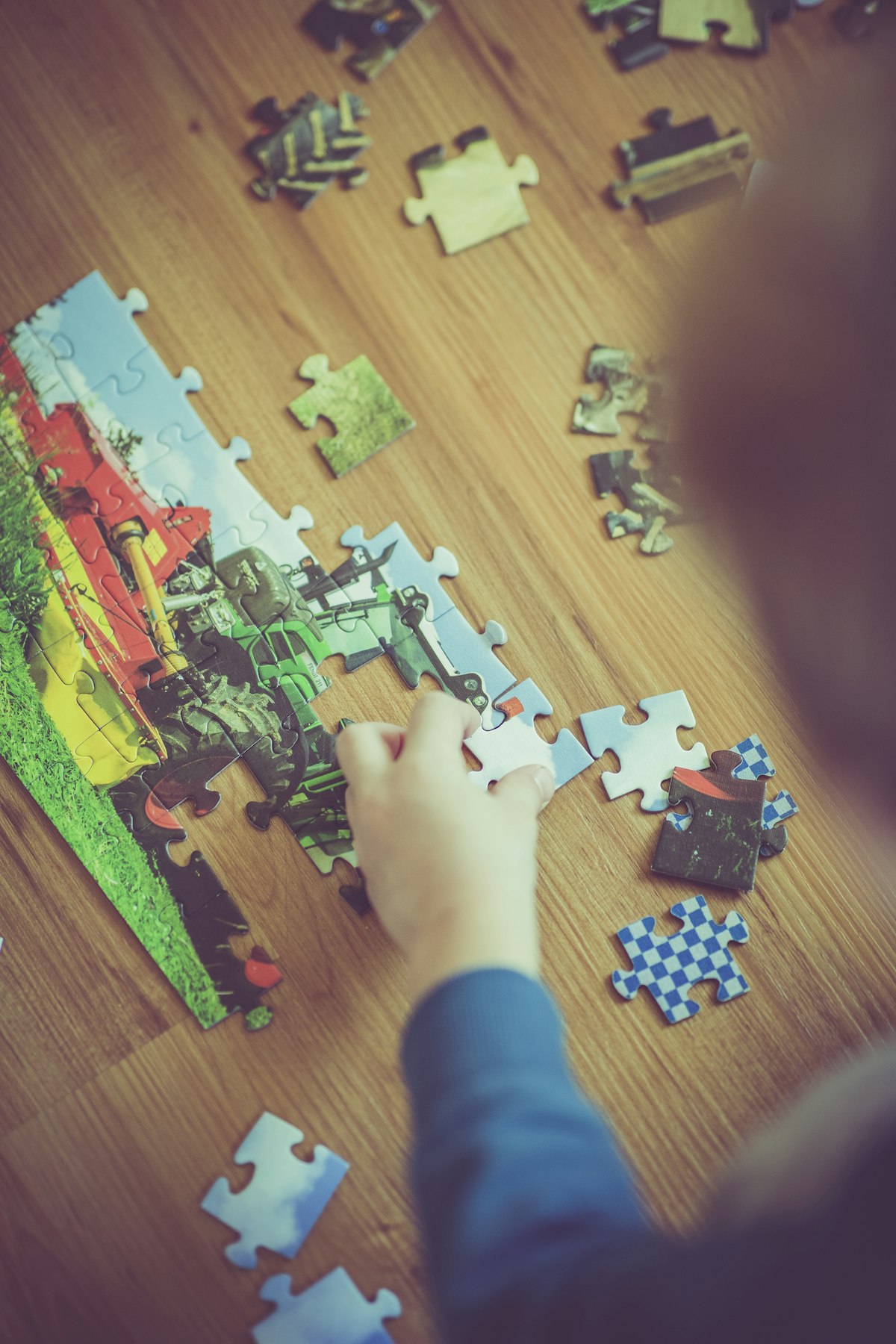 Child focused on solving a puzzle