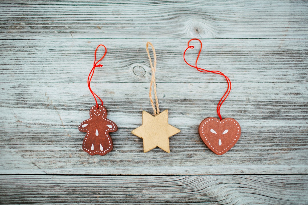 three hanging ornaments on white surface