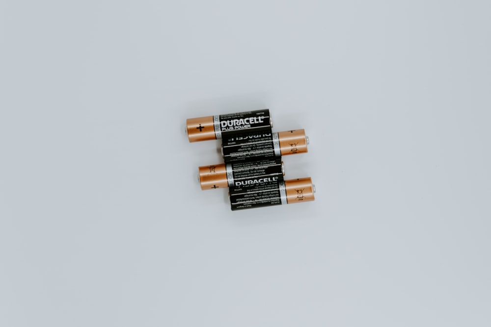 four black Duracell batteries