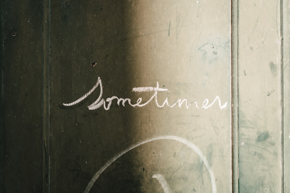 a close up of a door with writing on it