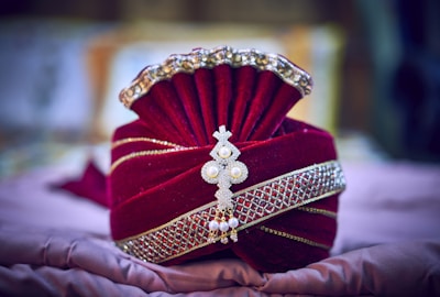 A close-up of a turban tied elegantly with detailed fabric texture.