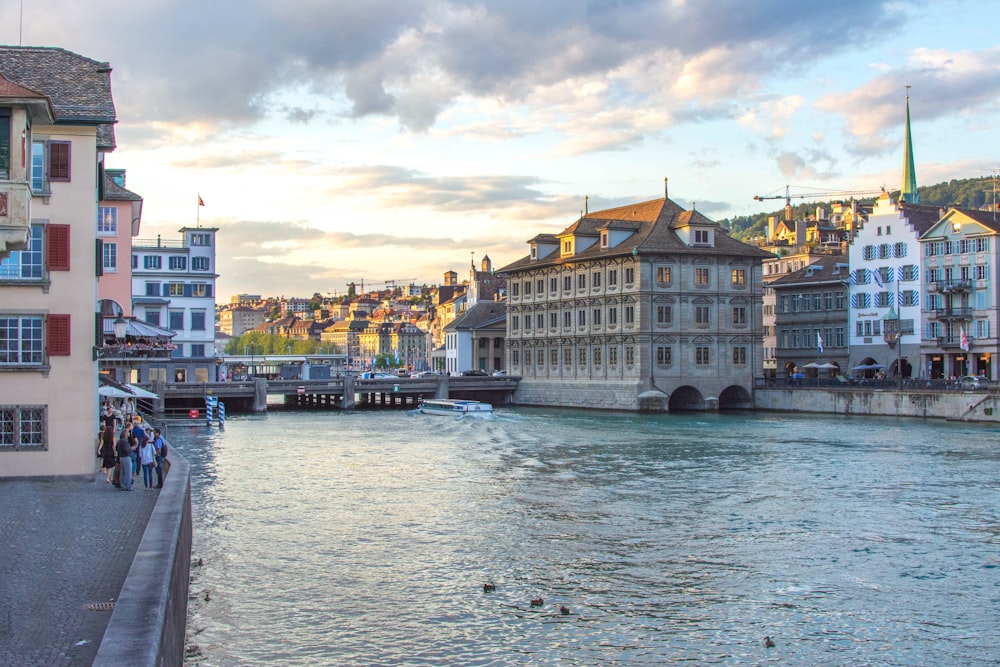 people walking beside river