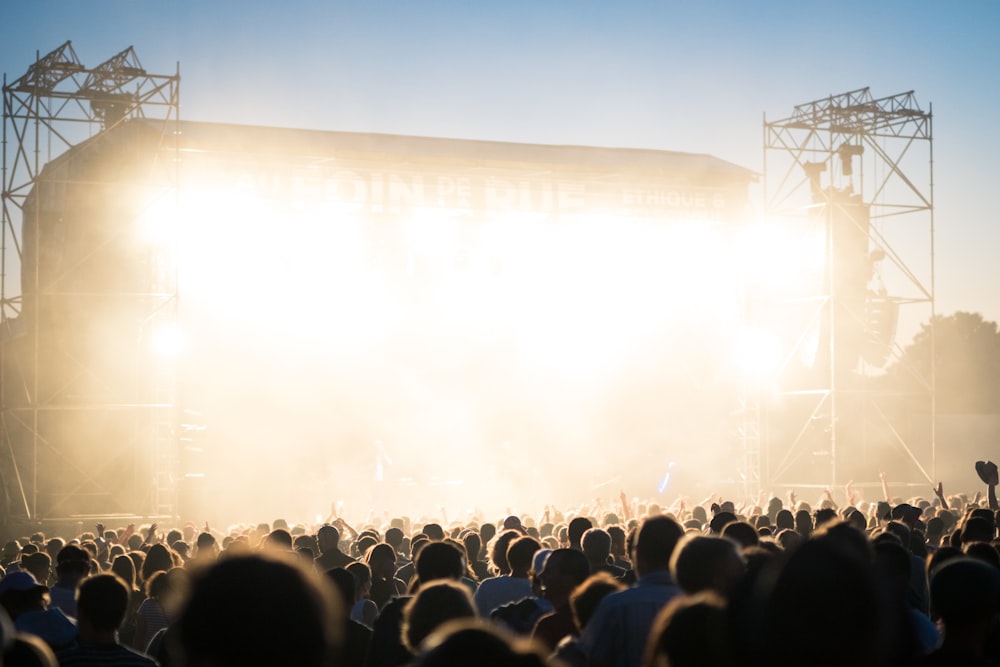 people watching concert during day