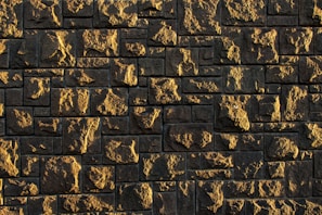 Natural stone blocks with rugged surfaces illuminated by soft daylight