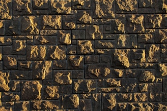 Natural stone blocks with rugged surfaces illuminated by soft daylight