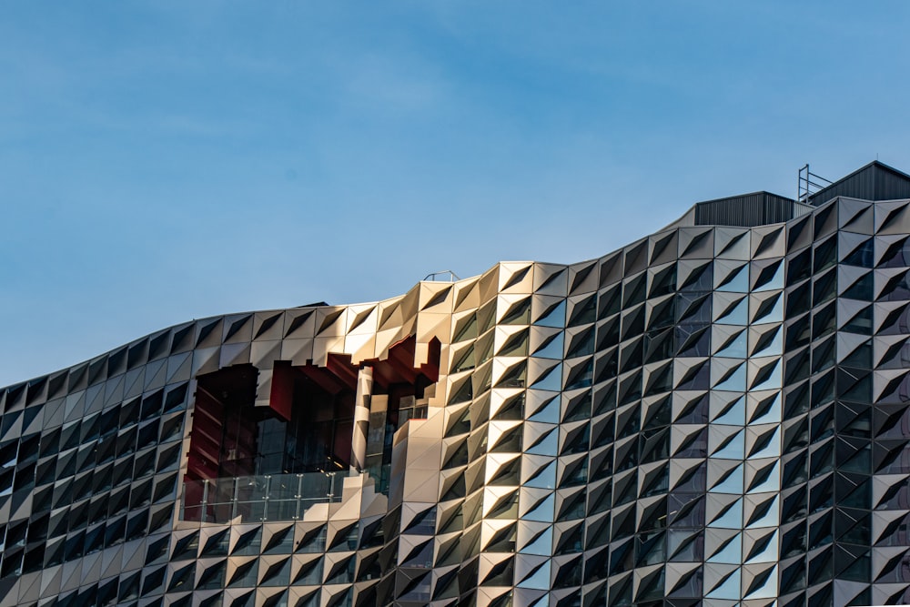 brown and grey high-rise building during clear blue sky