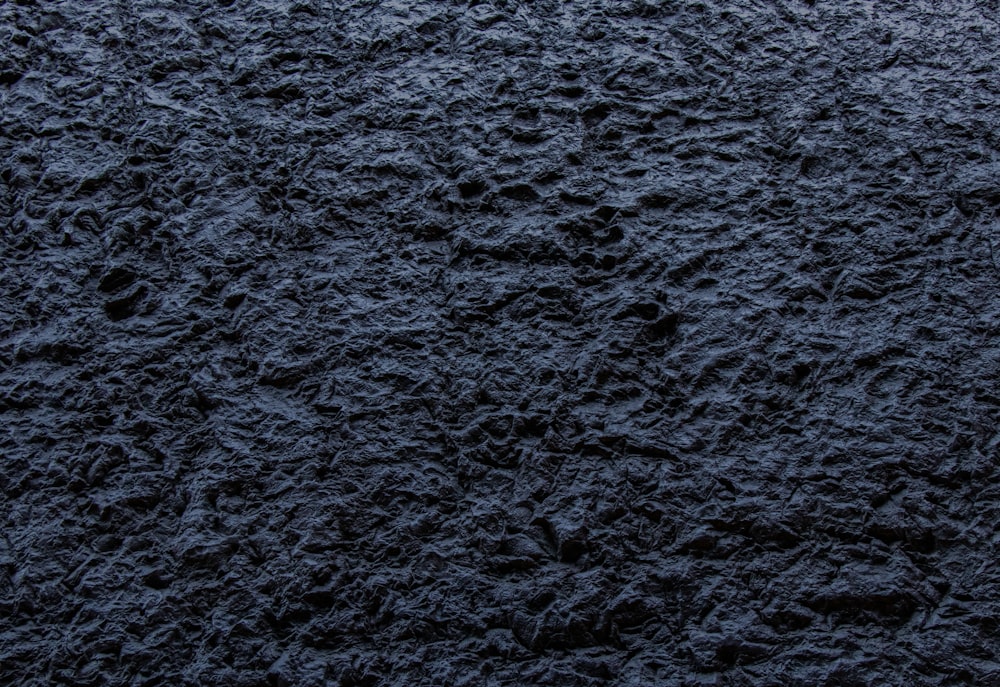 a close up view of a black surface
