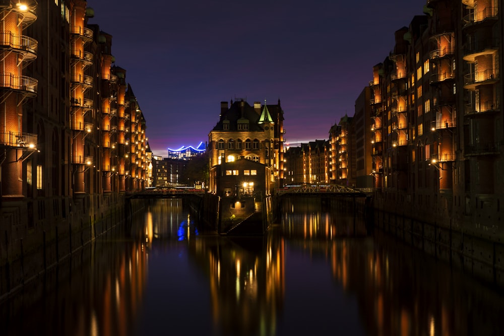 body of water beside building at night