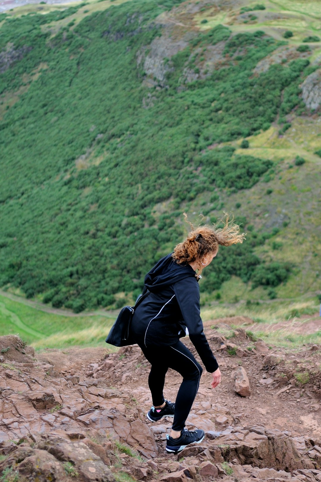 woman standing on mountain during daytime