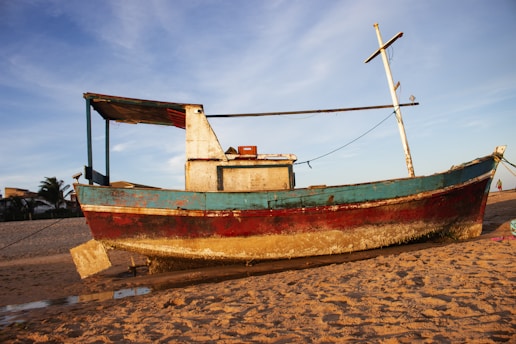 green and red wooden boat