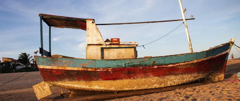 green and red wooden boat