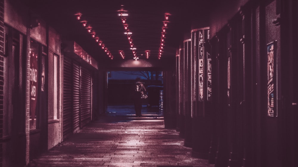 person walking in tunnel