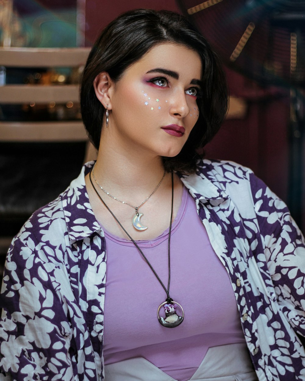 woman wearing purple and white floral cardigan