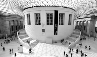 a black and white photo of people inside a building