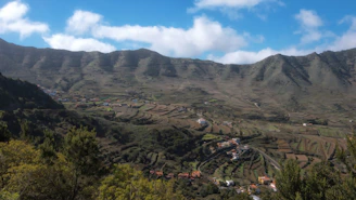 A breathtaking view of Hunza Valley's terraced fields under a clear blue sky.