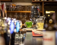 Cozy interior shot showing customers enjoying tea and snacks in a warm, inviting atmosphere.