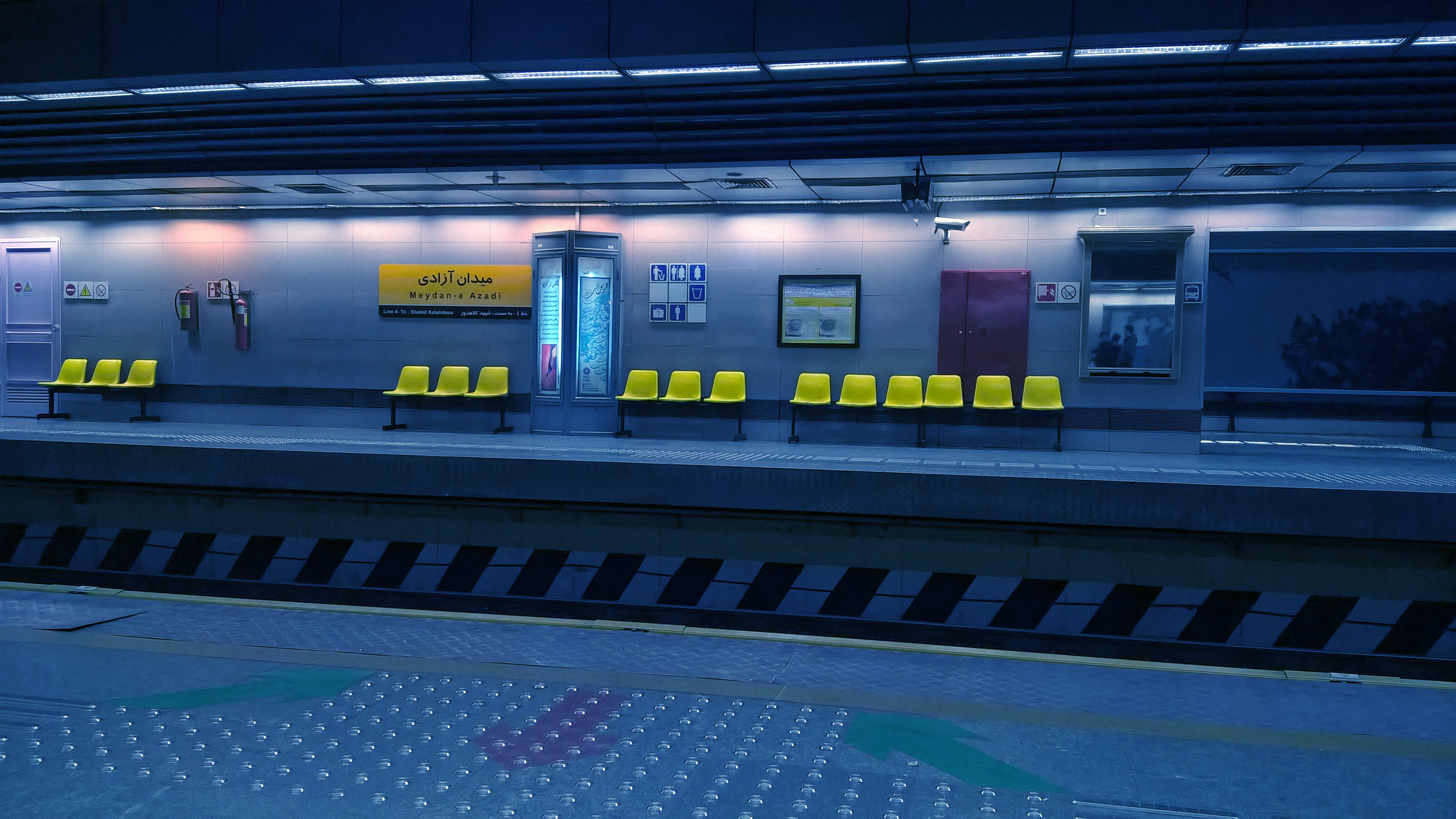 yellow gang chairs on train station