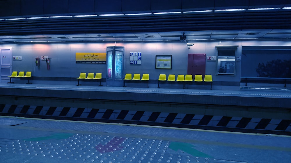 yellow gang chairs on train station