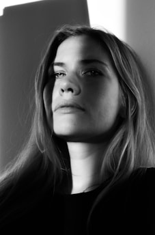 A contemplative semi-abstract portrait blending shadow and light, evoking deep emotional reflection.