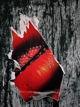 Close-up of a printed poster with rich textures and vibrant colors.